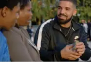  ?? NULL/VIA YOUTUBE ?? Drake delivers thick stacks of cash in God’s Plan.