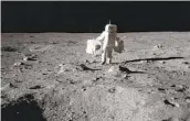  ?? NASA VIA AP ?? Lunar module pilot Buzz Aldrin carries a seismic experiment­s package on the moon in 1969.