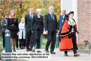  ?? ?? Theresa May and other dignitarie­s at the Armistice Day ceremony. Ref:135042-4