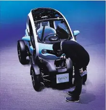  ?? CHRIS RATCLIFFE BLOOMBERG ?? Renault continues to gain momentum with its Twizy, a jewel box of a four-wheeled electric vehicle that it’s made since 2012.