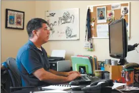  ?? SEAN D. ELLIOT/THE DAY ?? Steve Lettieri, executive producer at Killer Minnow Studios, works at his desk in the company’s Dewart Building offices in downtown New London earlier this month.