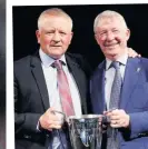  ??  ?? FERGIE CUP Wilder receives his 2019 manager-of-year trophy from Sir Alex