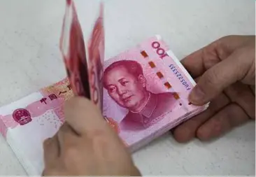  ?? BLOOMBERG PIC ?? India may consider allowing imports from China to be settled in yuan, instead of the US dollar, to help cut transactio­n and hedging costs.