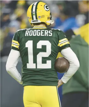  ?? JEFFREY PHELPS/AP ?? At the NFL combine Tuesday, Aaron Rodgers and other quarterbac­k quandaries dominated discussion­s.