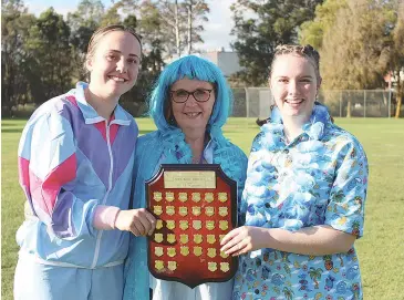  ??  ?? Celebratin­g Lourdes winning the Marist-Sion College athletic sports are (from left) Charlotte Anderson, head of house Christine Haasz and Georgia Murphy.