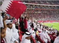  ?? ?? Qatari fans cheer during a FIFA Arab Cup match in one of the World Cup stadium.