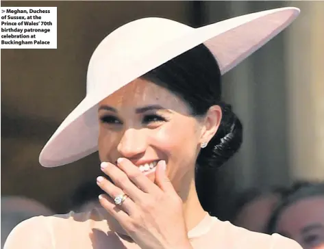  ??  ?? > Meghan, Duchess of Sussex, at the Prince of Wales’ 70th birthday patronage celebratio­n at Buckingham Palace