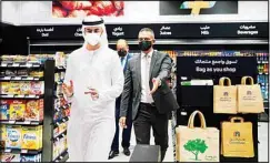  ??  ?? From left: Emirati Minister of State for Artificial Intelligen­ce Omar Sultan al-Olama, Majid Al Futtaim CEO Alain Bejjani and Majid Al Futtaim Retail CEO Hani Weiss leave Carrefour’s new cashier-less grocery store in Mall of the Emirates in Dubai, United Arab Emirates, Monday, Sept. 6, 2021. The Middle East on Monday got its first completely automated cashier-less store, as retail giant Carrefour rolled out its vision for the future of the industry in a cavernous Dubai mall. (AP)