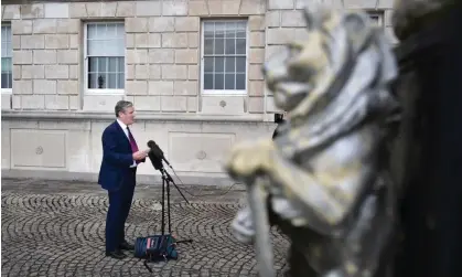  ?? Photograph: Charles McQuillan/Getty Images ?? Speaking to the media at Stormont on Friday, Keir Starmer said a Labour government would repeal legislatio­n on overriding NI protocol if it passes.