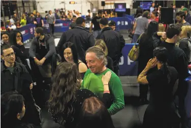  ?? Victor J. Blue / New York Times 2013 ?? CrossFit CEO Greg Glassman talks with fans in New York in 2013. Company employees say he fostered a culture of sexual harassment. He resigned over remarks he made over the death of George Floyd.