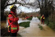  ?? AFP photo — ?? Rescuers take part in searching operations of seven missing persons on the Gardon river in Russan following heavy rain over south-eastern France.