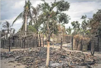  ?? Photo: Marco Longari/afp ?? The cycle of life: The remains of a burned and destroyed home in the village of Aldeia da Paz outside Macomia, in Cabo Delgado, Mozambique, in August last year after an attack by an Islamist group. This week, a woman gave birth to her baby on a boat, which she had boarded to flee the violence in the province.