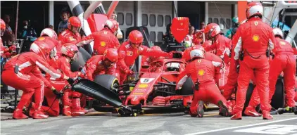  ??  ?? German F1 driver Sebastian Vettel of Scuderia Ferrari in the pit stop Photo: AP