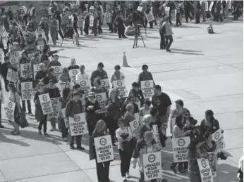  ?? RENÉ JOHNSTON/TORONTO STAR FILE PHOTO ?? Library workers went on strike for 11 days in 2012. Now, a strike or lockout is possible Sunday at midnight.