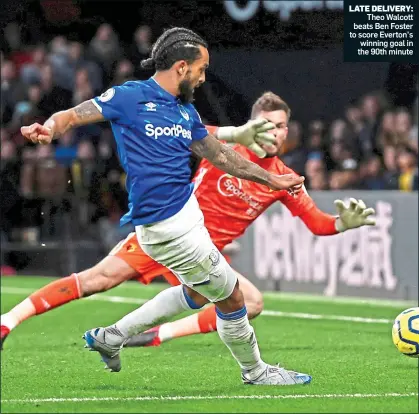  ??  ?? LATE DELIVERY:
Theo Walcott beats Ben Foster to score Everton’s winning goal in the 90th minute