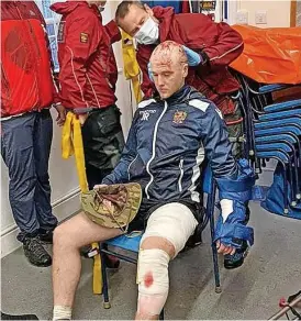  ??  ?? Jake Robinson receiving treatment after his 230ft fall off Snowdon’s Crib Goch, and, left, mountain rescue saving Jake after the fall. Below, Jake on Crib Goch