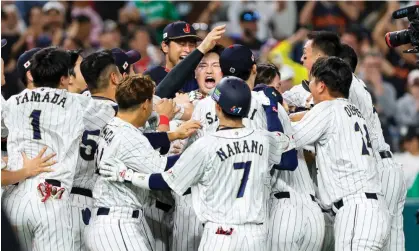  ?? Photograph: Sam Navarro/USA Today Sports ?? Japan celebrate their comeback victory over Mexico in the World Baseball Classic semi-final.