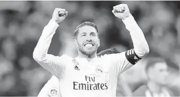  ?? GABRIEL BOUYS/GETTY-AFP ?? Real Madrid defender Sergio Ramos celebrates at the end of the Spanish league football match between Club Atletico de Madrid and Real Madrid CF at the Wanda Metropolit­ano stadium in Madrid on Saturday.