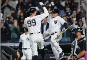  ?? FRANK FRANKLIN II — THE ASSOCIATED PRESS ?? The Yankees' Aaron Judge, left, celebrates with Anthony Rizzo after hitting a home run during the fifth inning against the Guardians on Friday in New York.