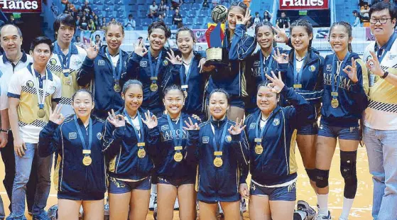  ??  ?? Members of Team National U, led by Conference MVP Jaja Santiago and Finals MVP Jasmine Nabor, flash the No. 3 sign after winning the PVL Collegiate Conference crown via sweep. The Lady Bulldogs also won the last two collegiate titles in the defunct...