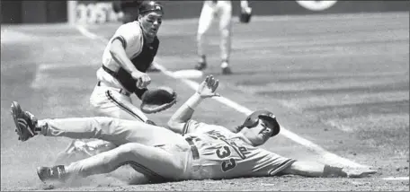  ?? Mark Hundley Associated Press ?? LARRY WALKER, sliding past San Francisco’s Kirt Manwaring, was one of the young stars who led the Expos to a 74-40 record in 1994.