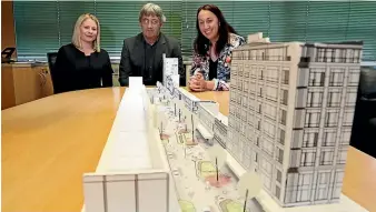  ?? ROBYN EDIE/STUFF ?? City streetscap­e project manager Tess Browne, left, Invercargi­ll City Council roading manager Russell Pearson, and council’s group infrastruc­ture manager Erin Moogan, check out a model of the preliminar­y designs for Esk St.