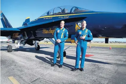  ?? SUSAN STOCKER/SUN SENTINEL ?? Lt. Commander Adam Kerrick and Lt. Cary Rickoff of the U.S. Navy Blue Angels arrive at Executive Airport for a planning meeting with Fort Lauderdale Air Show and city officials.