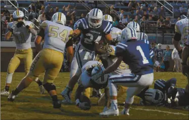  ??  ?? Left: Bremen’s Jake Verity broke a school and state record last week with a 63-yard free kick field goal. Top: Rockmart’s Maurice Smith drives into the end zone for a score against Bremen on Friday, Sept. 17.