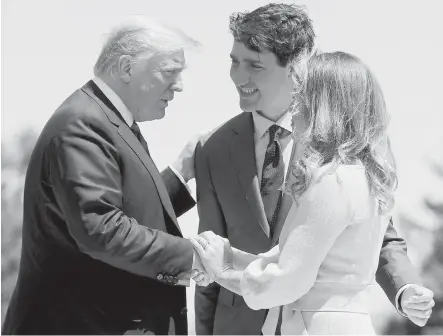  ?? TRIBUNE NEWS SERVICE ?? U.S. President Donald Trump is greeted by Prime Minister Justin Trudeau and his wife, Sophie Gregoire Trudeau, outside the Hotel Fairmont Le Manoir on June 8, for the G7 Summit in Quebec. Canada has enacted billions of dollars in retaliator­y tariffs against the U.S. in response to the Trump administra­tion’s duties on Canadian steel and aluminum.