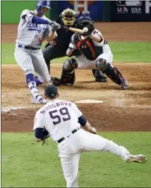  ?? CHARLIE RIEDEL — THE ASSOCIATED PRESS ?? Los Angeles Dodgers’ Joc Pederson hits a three-run home run off Houston Astros relief pitcher Joe Musgrove during the ninth inning of Game 4 of baseball’s World Series Saturday in Houston.