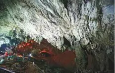  ?? AP ?? Rescue personnel walk out of the entrance to a cave complex where it’s believed that 12 soccer team members and their coach went missing, in northern Thailand yesterday.