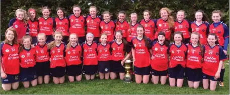  ??  ?? The Kilrush squad with the Division 1 Cup after their outstandin­g exploits at the national Féile na nGael last weekend.