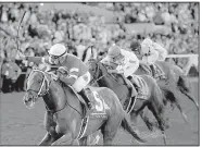  ?? AP/GREGORY BULL ?? Florent Geroux (left) rode Gun Runner to victory in the Breeders’ Cup Classic on Saturday in Del Mar, Calif. Gun Runner won by 2¼ lengths over Arrogate.