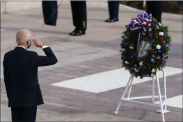  ?? ALEX BRANDON — THE ASSOCIATED PRESS ?? President Joe Biden salutes on Thursday before placing a wreath during a centennial ceremony for the Tomb of the Unknown Soldier in Arlington National Cemetery in Arlington, Va.