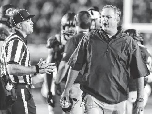  ?? KELLEY L COX, USA TODAY SPORTS ?? To discourage perceived flopping by defenders, California coach Sonny Dykes, above right, is in favor of a rule that would require injured players to sit out several plays before returning.