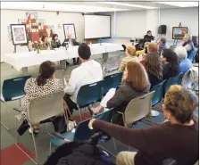  ?? Tyler Sizemore / Hearst Connecticu­t Media ?? Members of the audience get involved during a book launch event at the Government Center in Stamford in 2020 put on by the Parent Leadership Training Institute and other agencies.