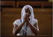  ?? INTI OCON — THE ASSOCIATED PRESS ?? A Catholic woman attends Sunday's mass at the Metropolit­an Cathedral in Managua, Nicaragua, on Sunday.