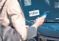  ?? DAVID PAUL MORRIS BLOOMBERG FILE PHOTO ?? Uber said last month it would allow its more than 150,000 drivers in California to see where potential riders were going, in effect letting them choose the trips they felt were worthwhile.