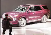  ??  ?? An attendee photograph­s the 2020 Hyundai Palisade SUV after it wasunveile­d at AutoMobili­ty LA, the trade show aheadof the LA Auto Show, on Nov 28, 2018, at the Los Angeles Convention Center. Hyundai Motor’stalks to build a low-cost carmaking factory with a local government suffered a setback on Wednesday.(RTRS)