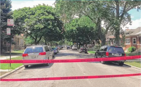  ?? | MATTHEW HENDRICKSO­N/ SUN- TIMES ?? A person was shot by Chicago Police Sunday in the Belmont Cragin neighborho­od.