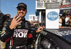  ?? JARED C. TILTON / GETTY IMAGES ?? Martin Truex Jr. (above) won his gamble on having sufficient fuel Sunday to survive Matt Kenseth’s late challenge at Watkins Glen Internatio­nal.