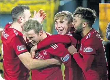  ??  ?? Aberdeen’s Considine, Wilson, Campbell and Mclennan celebrate after going 2-0 up