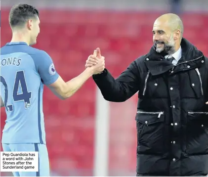  ??  ?? Pep Guardiola has a word with John Stones after the Sunderland game