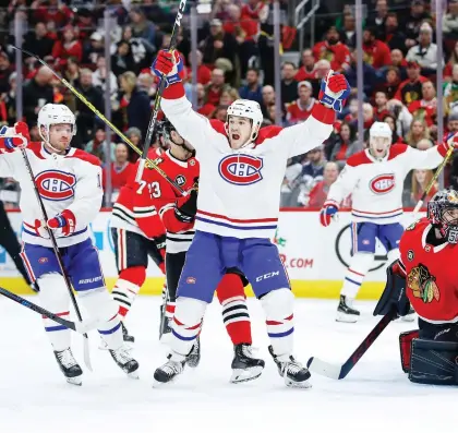  ?? KaMIL KRZACZYNSK­I/AP ?? Canadiens right wing Andrew Shaw reacts to a first-period goal by left wing Max Domi against Blackhawks goaltender Corey Crawford on Sunday in Chicago. It was Domi’s 14th goal of the season.