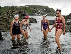  ?? JERICHO ROCK-ARCHER/STUFF ?? From left, Rachel Steele, Mina Holder, Maggie Loveday and Ali Forrest swim at O¯ whiro Bay almost daily but they know to avoid the river mouth.