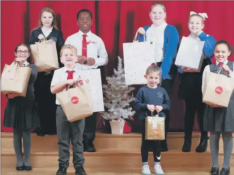  ?? Picture: Chris Moorhouse (jpns 071221-20) ?? A TIME FOR GIVING From left, Elizabetta, 10, Alicia, 10, Teddy, 7, Mark, 10, Freya, 10, Nellie, 5, Betty, 8 and Isabelle, 7 with their kindness bags. The children are from St Paul’s Catholic Primary School, Beacon View Primary School, and Victory Primary School. The bags will be given to local families at Christmas