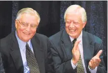  ?? ANDY KING / AP ?? Former President Jimmy Carter, right, claps for his former Vice President Walter Mondale, left, in a 2001 file photo.