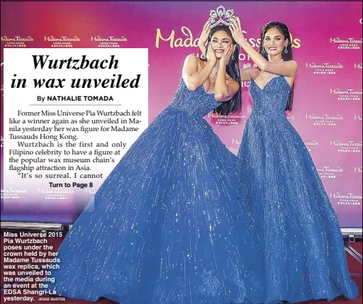  ?? JESSE BUSTOS ?? Miss Universe 2015 Pia Wurtzbach poses under the crown held by her Madame Tussauds wax replica, which was unveiled to the media during an event at the EDSA Shangri-La yesterday.