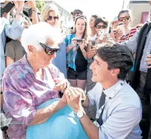  ?? JEFF BASSETT/THE CANADIAN PRESS ?? Prime Minister Justin Trudeau chats with Ethel McCraken, 90, during an event stop in Revelstoke, B.C., on Saturday.