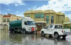  ?? Dubai Municipali­ty ?? Dubai Municipali­ty workers pump out flood water